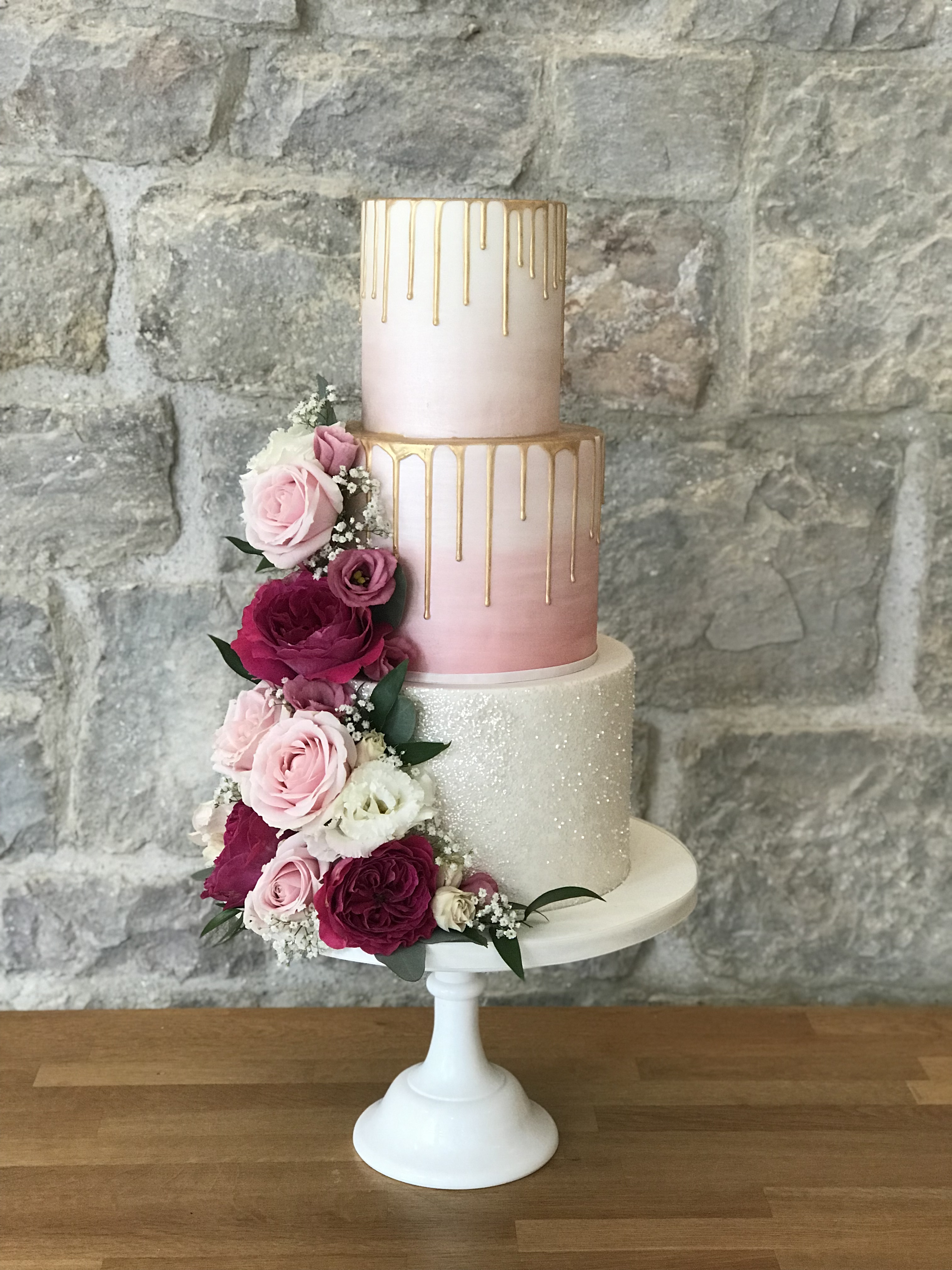 St Tewdricks Wedding Cake, Blush pink ombre with gold drips and real flowers